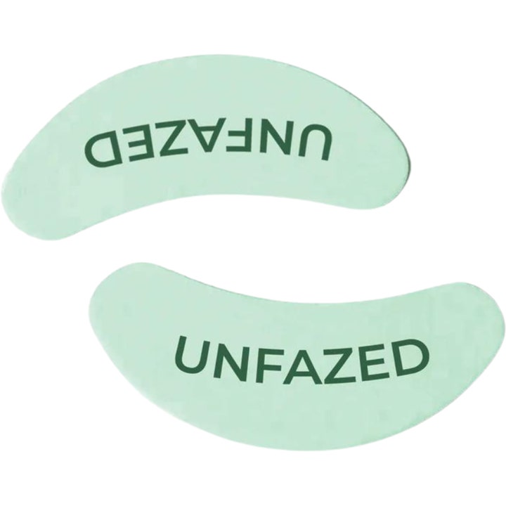 Unfazed Eye Patches 1 par mod mørke rande viser to lysegrønne bueformede patches med mørkegrøn UNFAZED tekst.