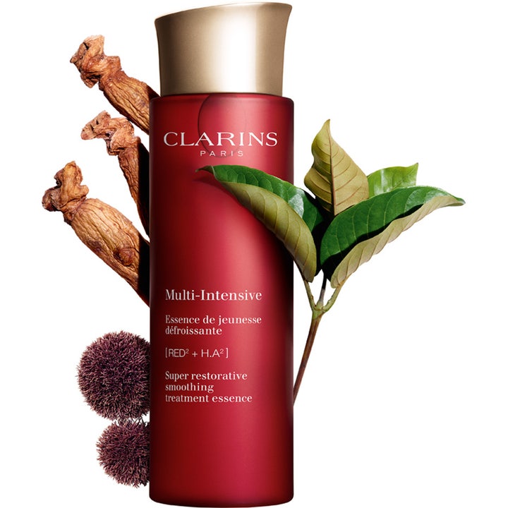 Clarins Super Restorative Treatment Essence 200 ml udglattende ansigtsvand i rød flaske med ginsengrødder