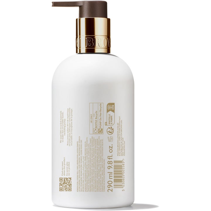 Molton Brown Milk Musk Body Lotion 300 ml fugtgivende kropspleje i hvid flaske med guldhals og brun pumpe set bagfra