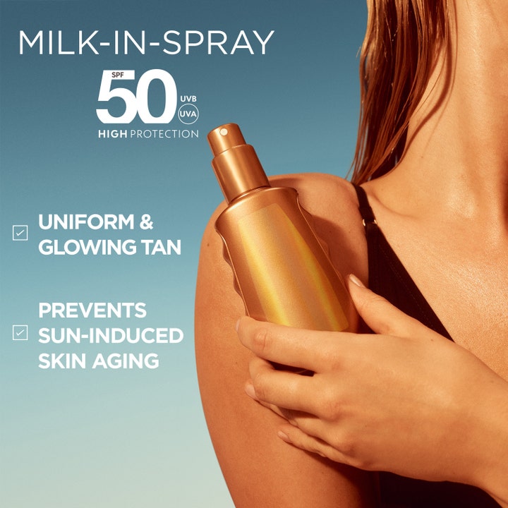 Garnier Ambre Solaire Ideal Bronze Milk-in-Spray 150 ml solcreme SPF 50 i bronze flaske der giver en jævn glød