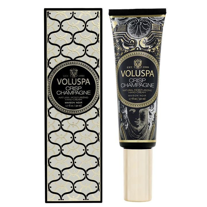 Voluspa Crisp Champagne 50 ml fugtgivende håndcreme i elegant sort tube med guldprint og mønstret æske