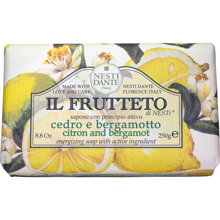 Nesti Dante Il Frutteto Citron & Bergamot 250g energigivende fast sæbe med illustrationer af gule citroner og hvide blomster.