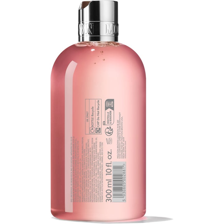 Molton Brown Delicious Rhubarb & Rose 300 ml showergel med lyserød tekstur set fra bagsiden af flasken