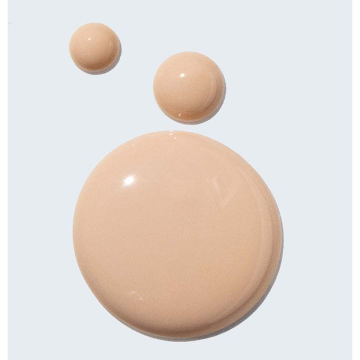 Murad City Skin Broad Spectrum SPF50 50 ml solcreme med ferskenfarvede dråber af letflydende ansigtscreme.