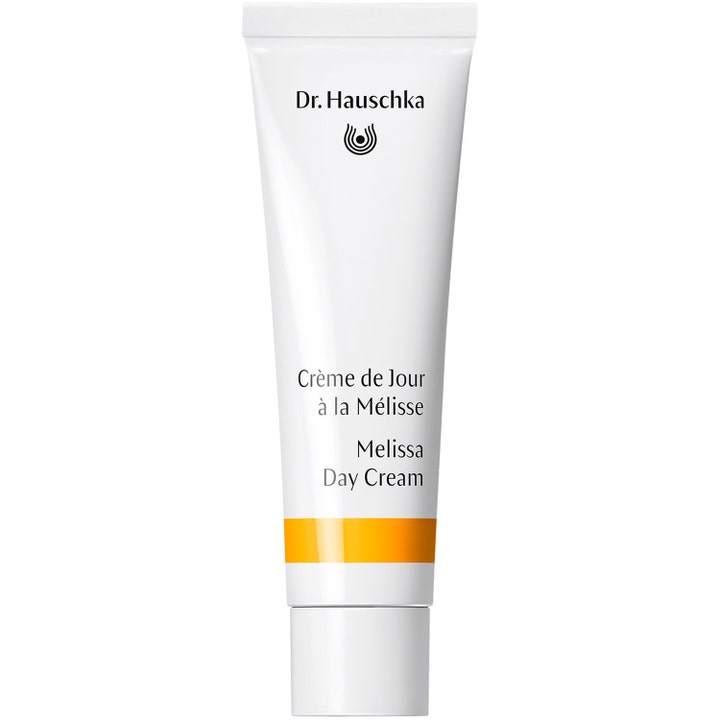 Dr. Hauschka Melissa Day Cream balancerende ansigtscreme i hvid tube med gul detalje og hvidt låg.