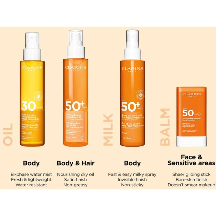 Clarins Glowing Sun Care Mist SPF 50+ 150 ml solbeskyttelse til krop og hår i orange sprayflaske med hvid pumpe
