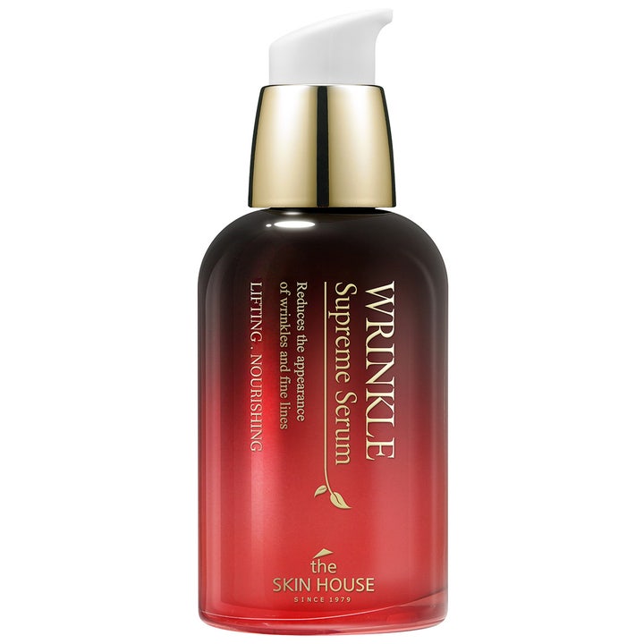 The Skin House Wrinkle Supreme Serum opstrammende ansigtsserum i rød gradient glasflaske med gulddetaljer