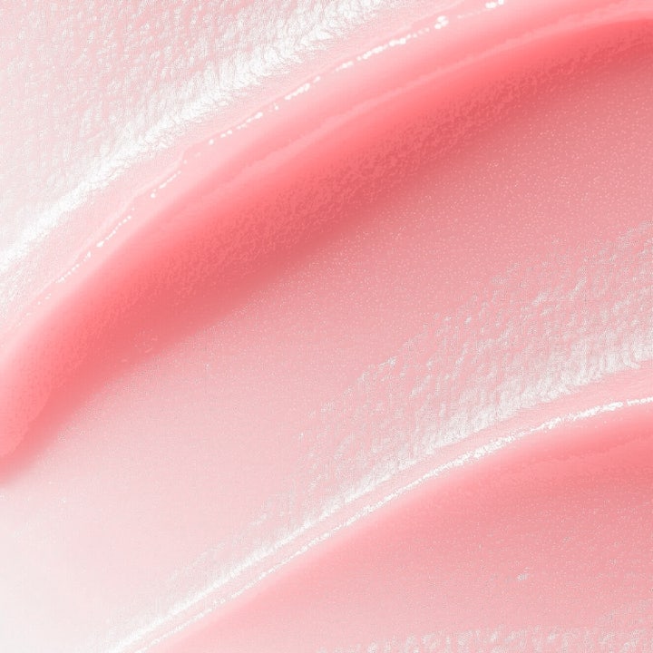 MANTLE The Rose Balm 15 ml udglattende rosebalm viser en blød lyserød cremet tekstur med glansfuld finish