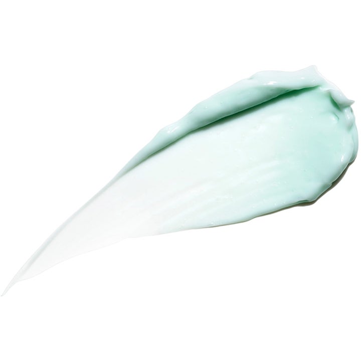 Exuviance Overnight Transformation Complex 50 g natcreme med en cremet lyseblå tekstur der fugter huden