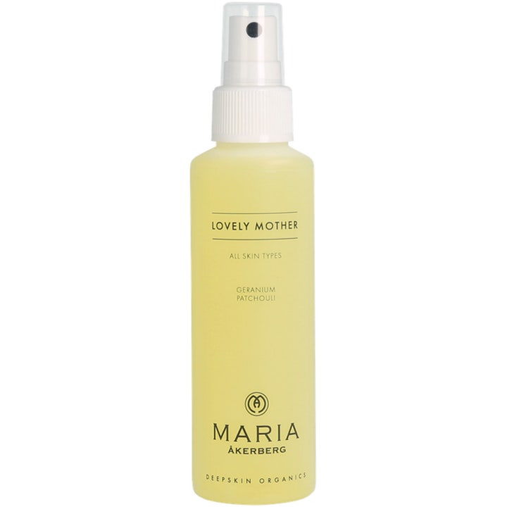 Maria Åkerberg Lovely Mother kropsspray der giver pleje i en slank flaske med hvid pumpe og lysegul væske.