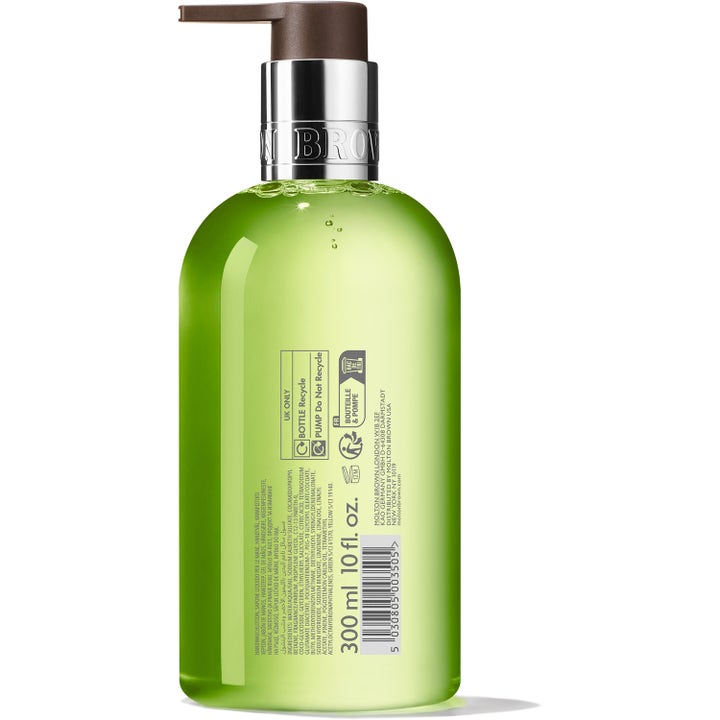 Molton Brown Lime & Patchouli Fine Liquid Hand Wash 300 ml håndsæbe viser flaskens bagside med ingrediensliste og grøn gel.