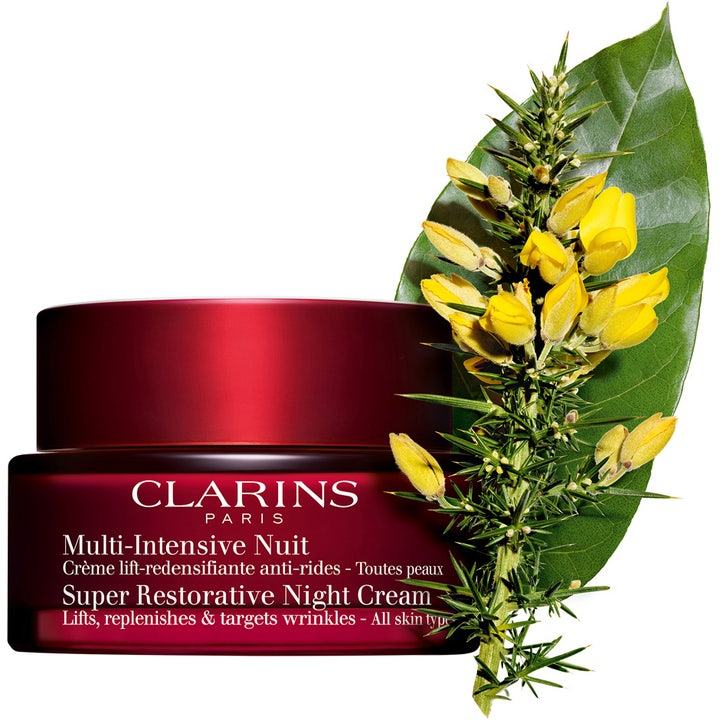Clarins Super Restorative Night Cream 50 ml natcreme der løfter huden i rød krukke med gule blomster og blade.