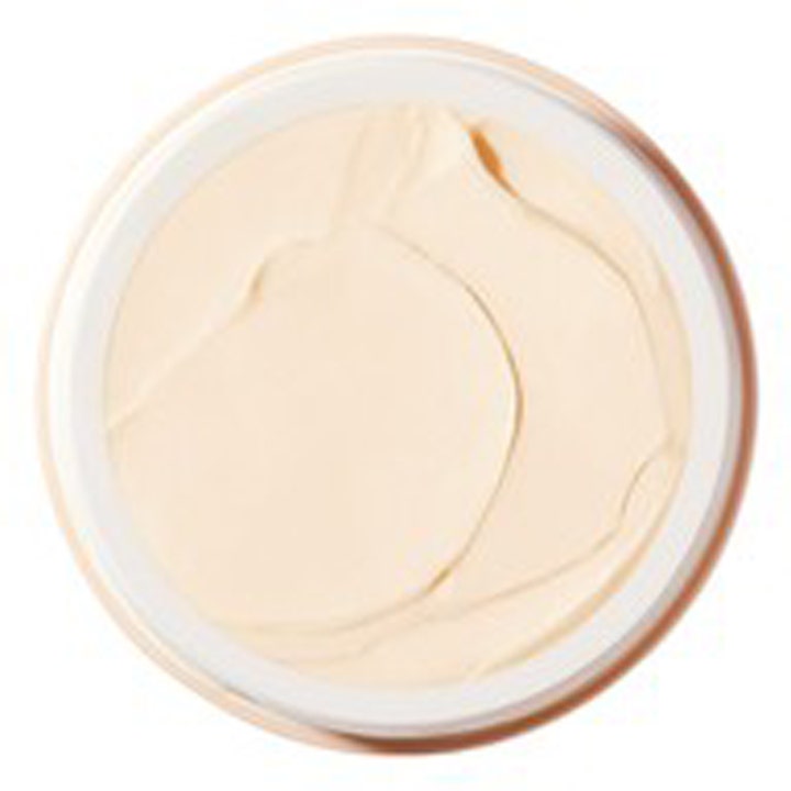 Nuxe Rêve de Miel Face Cream 50 ml nærende ansigtscreme viser en fyldig og cremet beige tekstur set oppefra i krukken.
