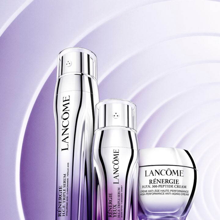 Lancôme Rénergie H.C.F. Triple Serum Eye 20 ml anti-age øgenserum i sølvfarvet emballage mod lilla bølget baggrund.