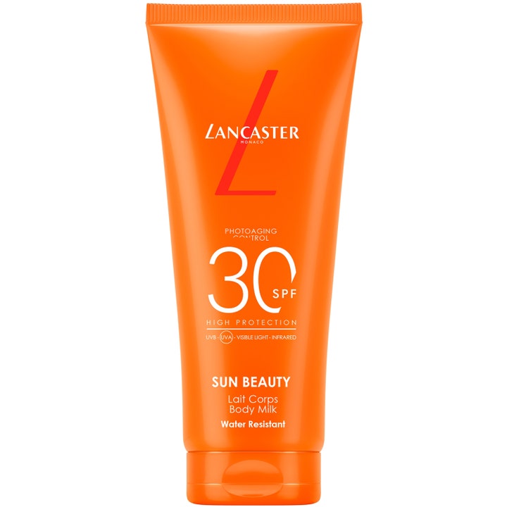 Lancaster Sun Beauty Body Milk SPF 30 solcreme mod fotoaldring i en klar orange tube med hvid tekst.