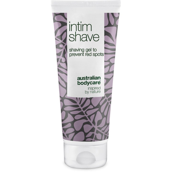 Australian Bodycare Intim Shave barbergel mod røde knopper i hvid tube med lilla bladmønster og hvidt låg