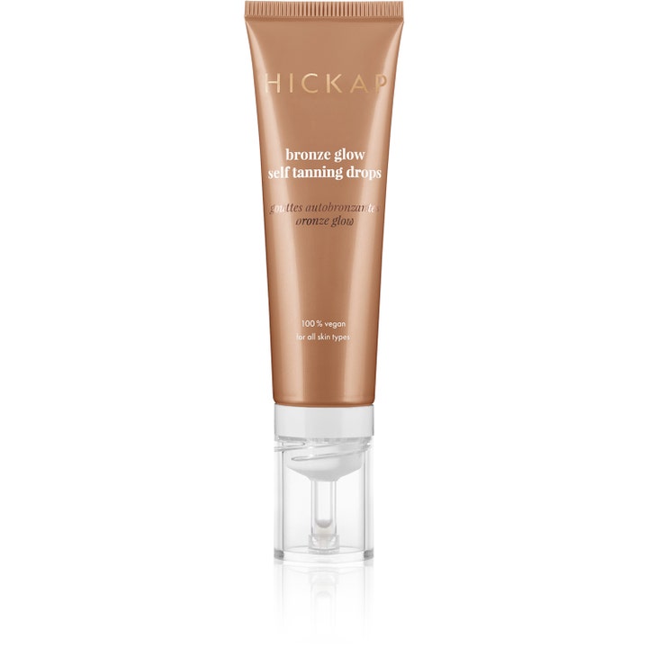 Hickap Bronze Glow Self Tanning Drops selvbruner dråber giver glød i en bronzefarvet tube med gennemsigtig pumpe.