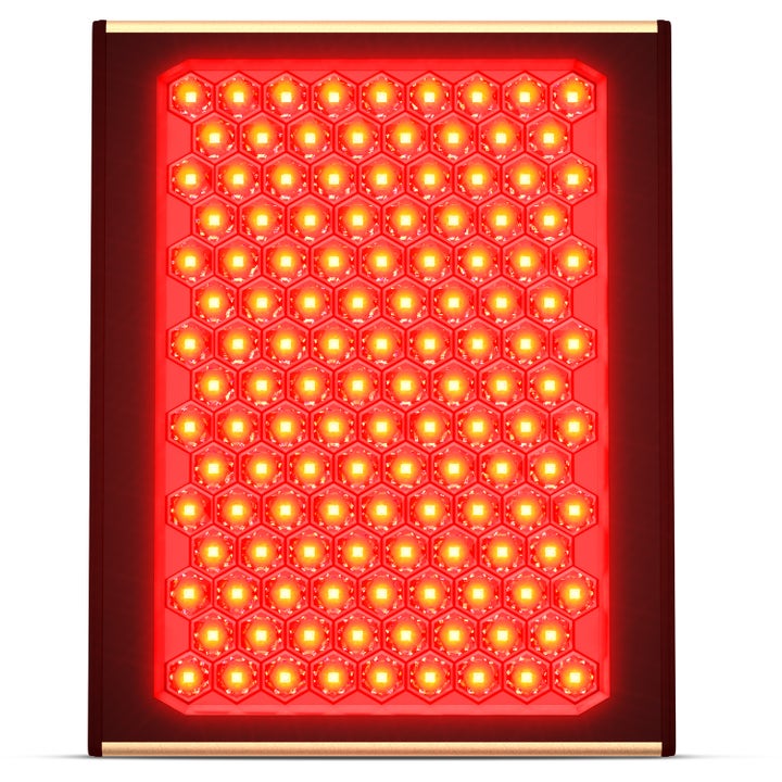 Rødlysterapi Panel 1 stk til hudpleje med lysende røde LED-dioder i et bikubemønster og mørk ramme.
