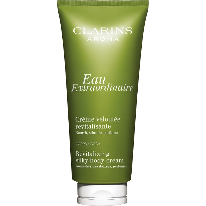 Clarins Eau Extraordinaire Revitalizing Silky Body Cream nærende kropscreme i en olivengrøn tube med hvidt låg