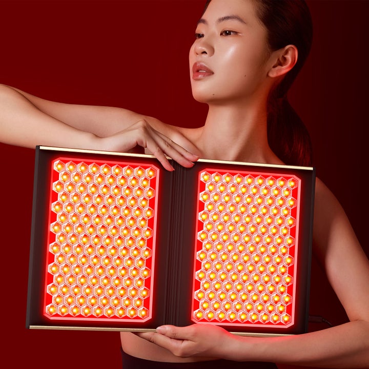 FAQ Swiss FAQ Dual Led Panel 1 stk hudplejeværktøj mod aldringstegn med kraftige røde og orange LED-lys i bikubemønster.
