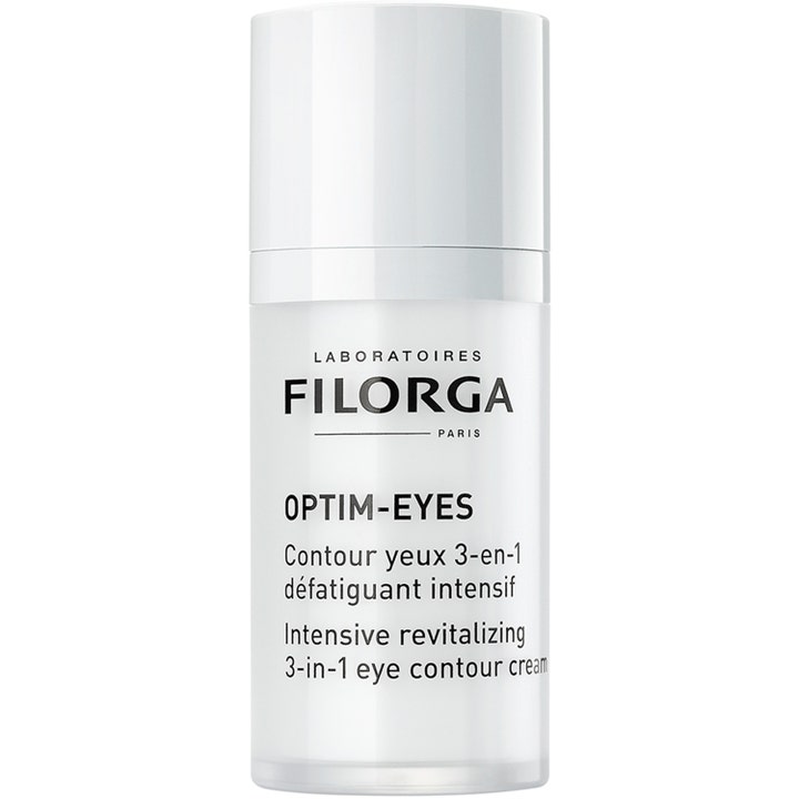 Filorga Optim-Eyes 15 ml revitaliserende øjencreme i hvid cylinderformet pumpeflaske mod mørke rande.