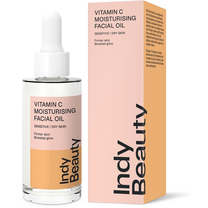 Indy Beauty Vitamin C Moisturising Facial Oil 30 ml fugtgivende ansigtsolie i klar glasflaske og lyserød æske