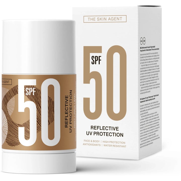 The Skin Agent Reflective UV Protection SPF 50 solstift til krop og ansigt i hvid emballage med gyldne detaljer