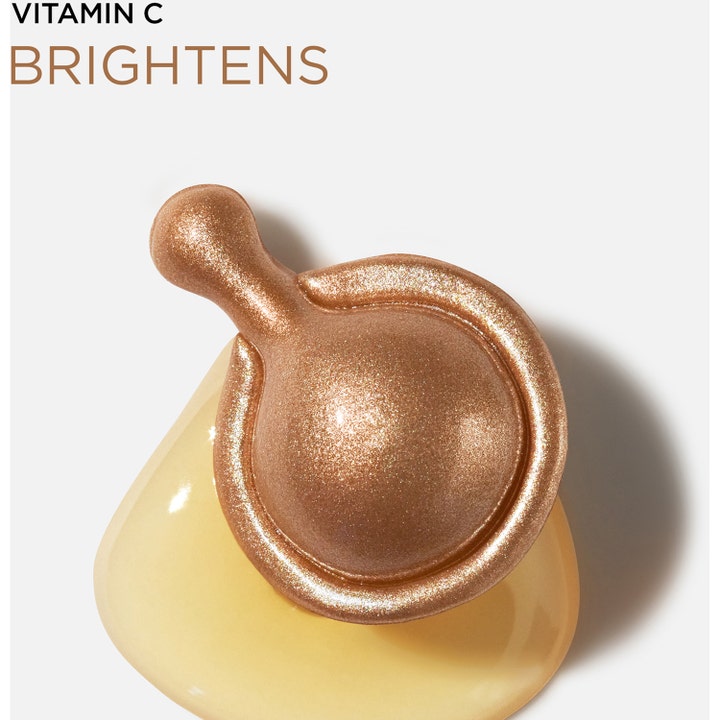 Elizabeth Arden Ceramide Capsules Vitamin C 30 stk. serum giver glød med bronze kapsel på en dråbe olie