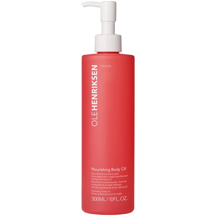 OleHenriksen Touch Nourishing Body Oil 300ml fugtgivende kropsolie i en mat rød flaske med hvid pumpe