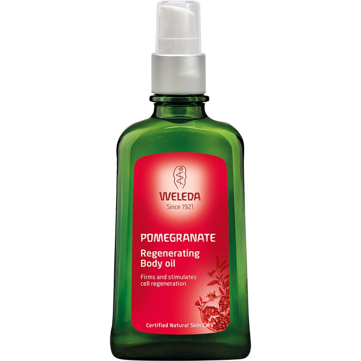 Weleda Pomegranate Regenerating Body Oil 100 ml opstrammende kropsolie i en grøn glasflaske med rød etiket og pumpe