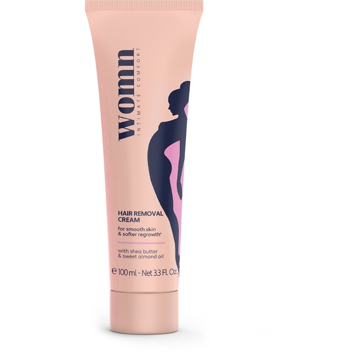 Womn Hair Removal Cream 100 ml blødgørende hårfjerningscreme i ferskenfarvet tube med mørkeblå kvindesilhuet.