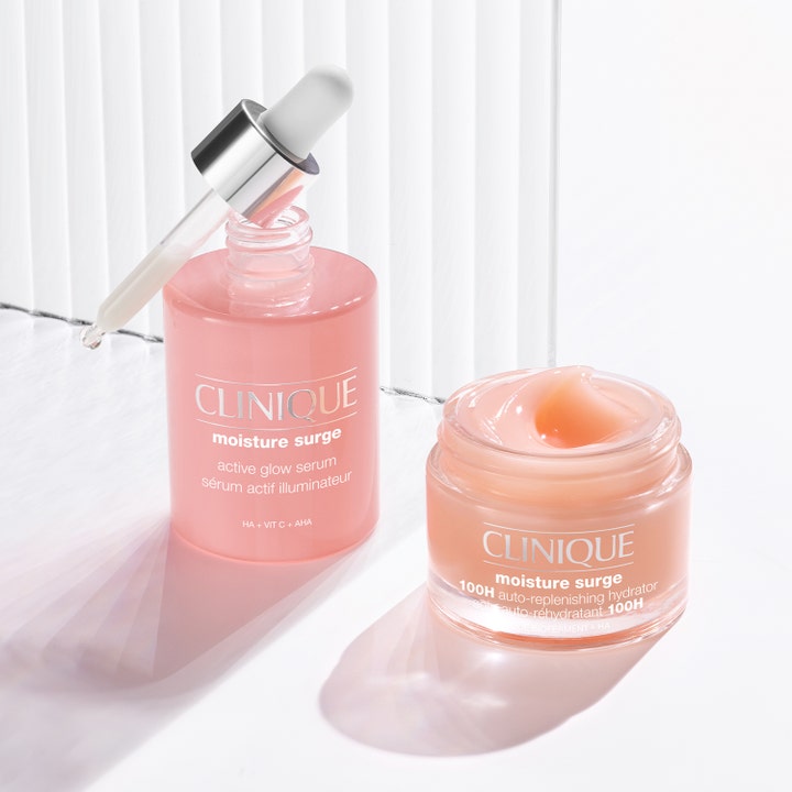 Clinique Moisture Surge Active Glow Serum 30 ml fugtgivende serum i pink flaske med pipette og åben krukke creme.