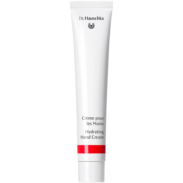 Dr. Hauschka Hydrating Hand Cream fugtgivende håndcreme i hvid tube med sort skrift og en rød stribe.