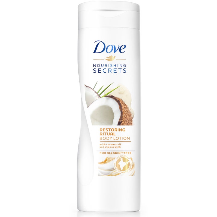 Dove Nourishing Secrets Restoring Ritual Body Lotion plejende bodylotion med kokosolie og mandelmælk i hvid flaske