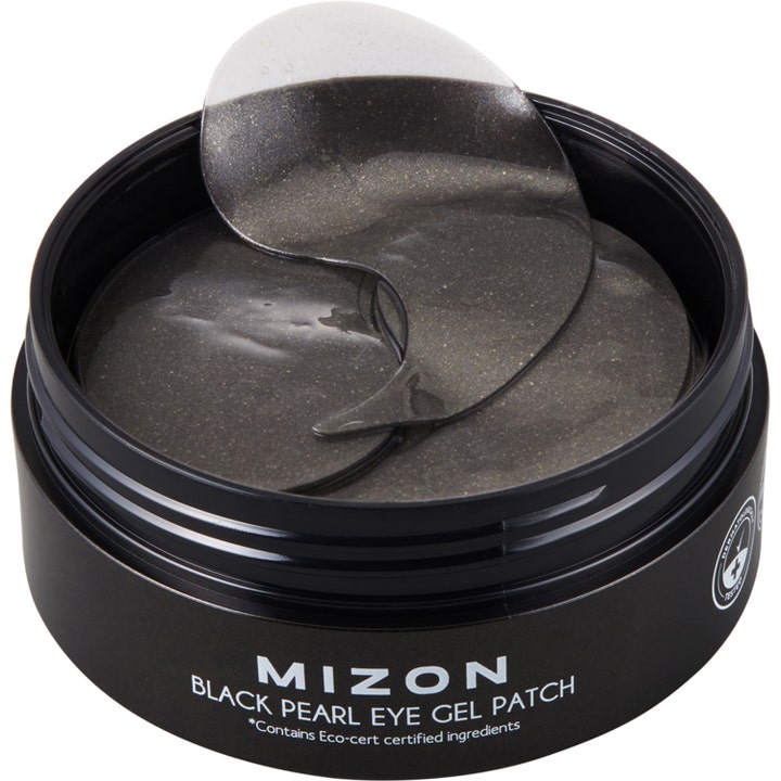 Mizon Black Pearl Eye Gel Patch 84 g mod mørke rande i åben sort krukke med glitrende øjenmasker