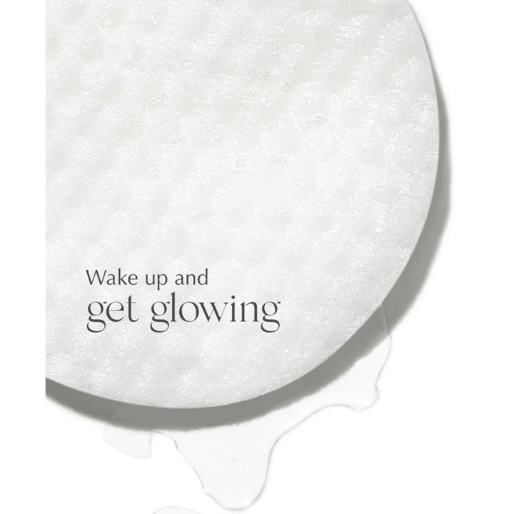 Exuviance SkinRise Morning Glow 36 stk serum pads giver glød med en hvid tekstureret rondel og flydende serum