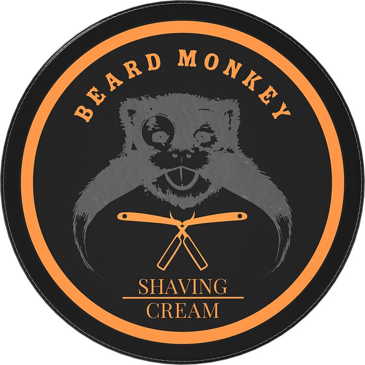 Beard Monkey Shaving Cream til blød barbering i dåse med sort låg, orange cirkel og logo med abe og barberknive.