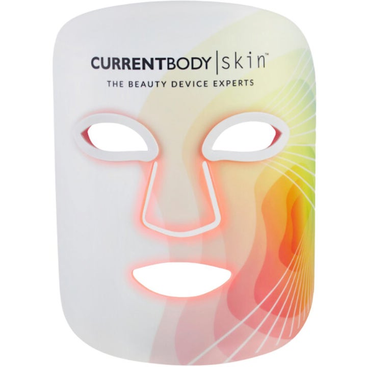 CurrentBody Skin LED Light Therapy Mask 1 stk hudforyngende LED maske i hvid silikone med rødt lys og farvet grafik