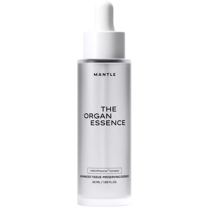 Mantle The Organ Essence 50 ml plejende ansigtsserum i frostet glasflaske med hvid pipette der giver glød.