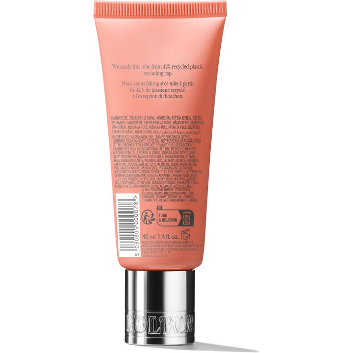 Molton Brown Heavenly Gingerlily Hand Cream 40 ml fugtgivende håndcreme i ferskenfarvet tube set bagfra med sølvlåg