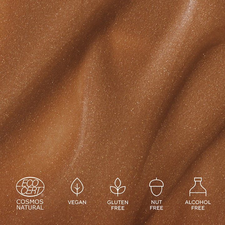 MÁDARA H2O Tint Hyaluron Tinted Serum #5 Dream Flower 30 ml giver glød med glitrende bronzefarvet tekstur og veganske ikoner.