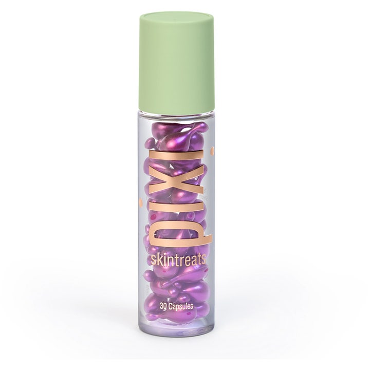 Pixi Skintreats 30 Capsules glødgivende ansigtsserum i gennemsigtig flaske med lilla kapsler og lysegrønt låg.