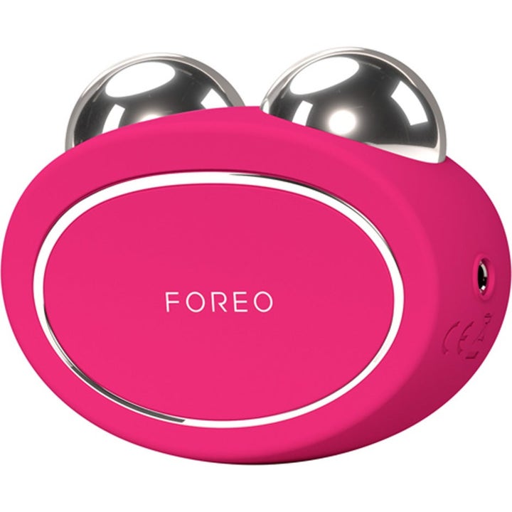 FOREO BEAR 2 Fuchsia ansigtsenhed til opstrammende ansigtspleje i pink silikone med to sølv metalkugler