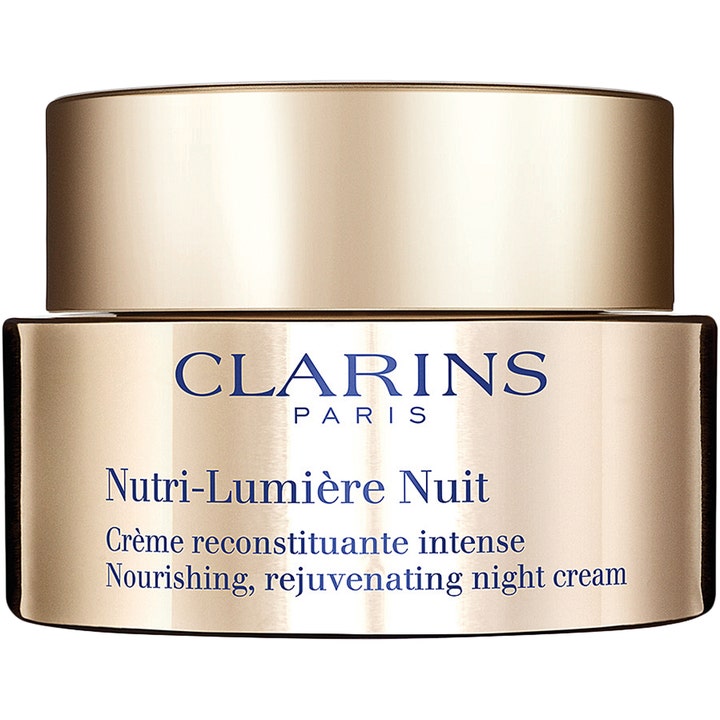 Clarins Nutri-Lumière Nuit 50 ml nærende natcreme der genopbygger huden i en elegant guldfarvet krukke med blåt logo
