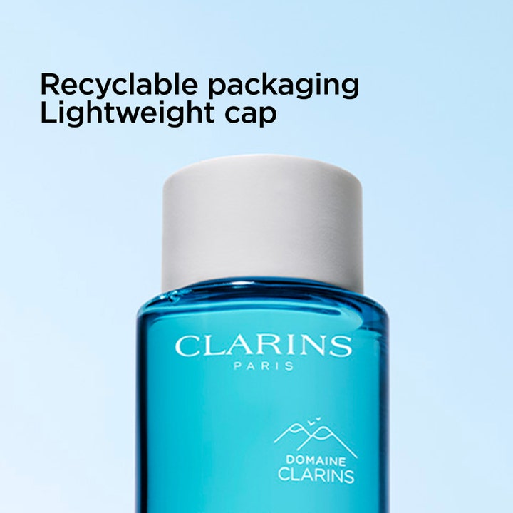 Clarins Gentle Eye Make-Up Remover 125 ml øjenmakeupfjerner i blå flaske med hvidt låg og tekst om genanvendelig emballage