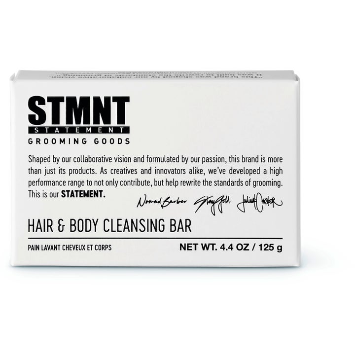 STMNT Grooming Goods Hair & Body Soapbar 125 g rensende fast sæbe til krop og hår i hvid papemballage med sort tekst.