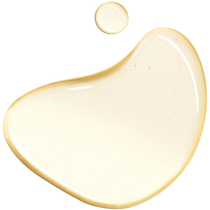 Clarins Total Cleansing Oil 150 ml ansigtsrens viser en gennemsigtig gylden olietekstur med fine luftbobler