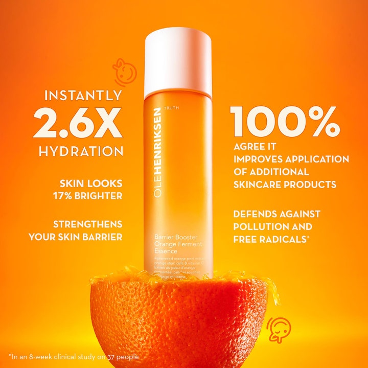 Ole Henriksen Truth Barrier Booster Ferment Essence 118 ml styrkende essence i orange flaske placeret i en frisk appelsin