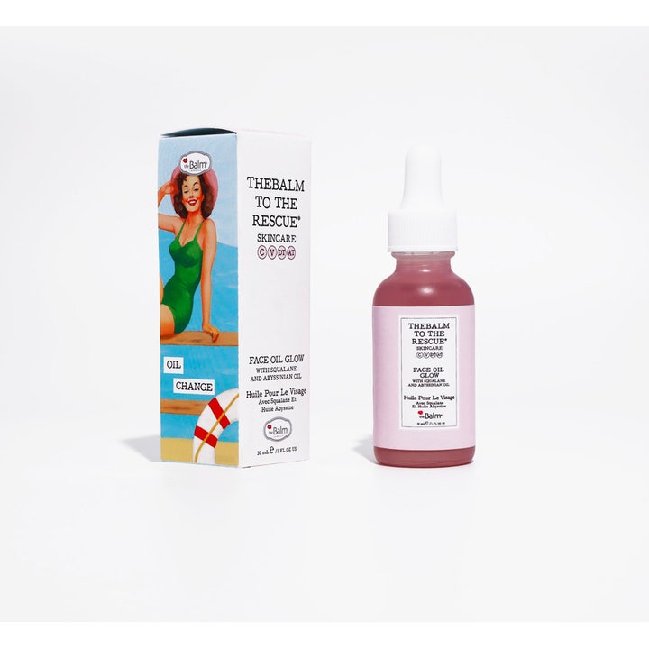 theBalm to the Rescue Face Oil Glow Serum 30 ml giver glød i lyserød glasflaske med hvid pipette og dekorativ æske