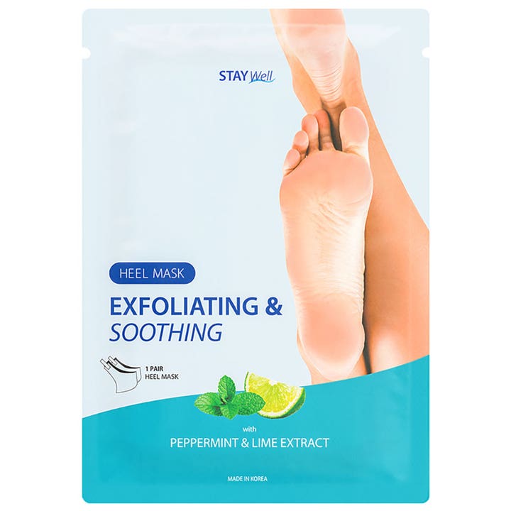 Stay Well Heel Mask Exfoliating & Soothing 1 par eksfolierende fodmaske i lyseblå pose med lime og mynteblade